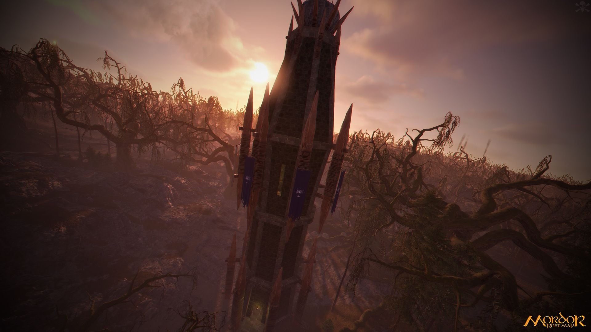 A dark spiked tower against a hazy orange sky, surrounded by bare twisted trees, on the custom Rust map Mordor