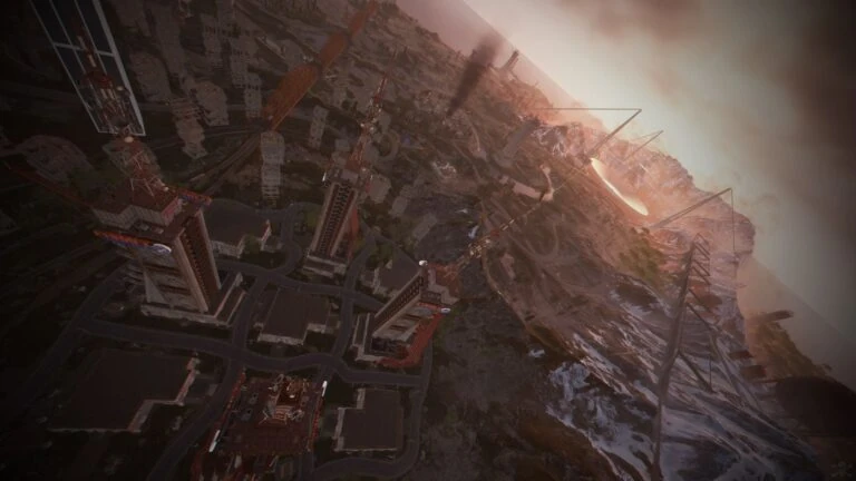 Aerial view of a ruined city of tower blocks and roads beside a rocky ridge, on the custom Rust map Extraction